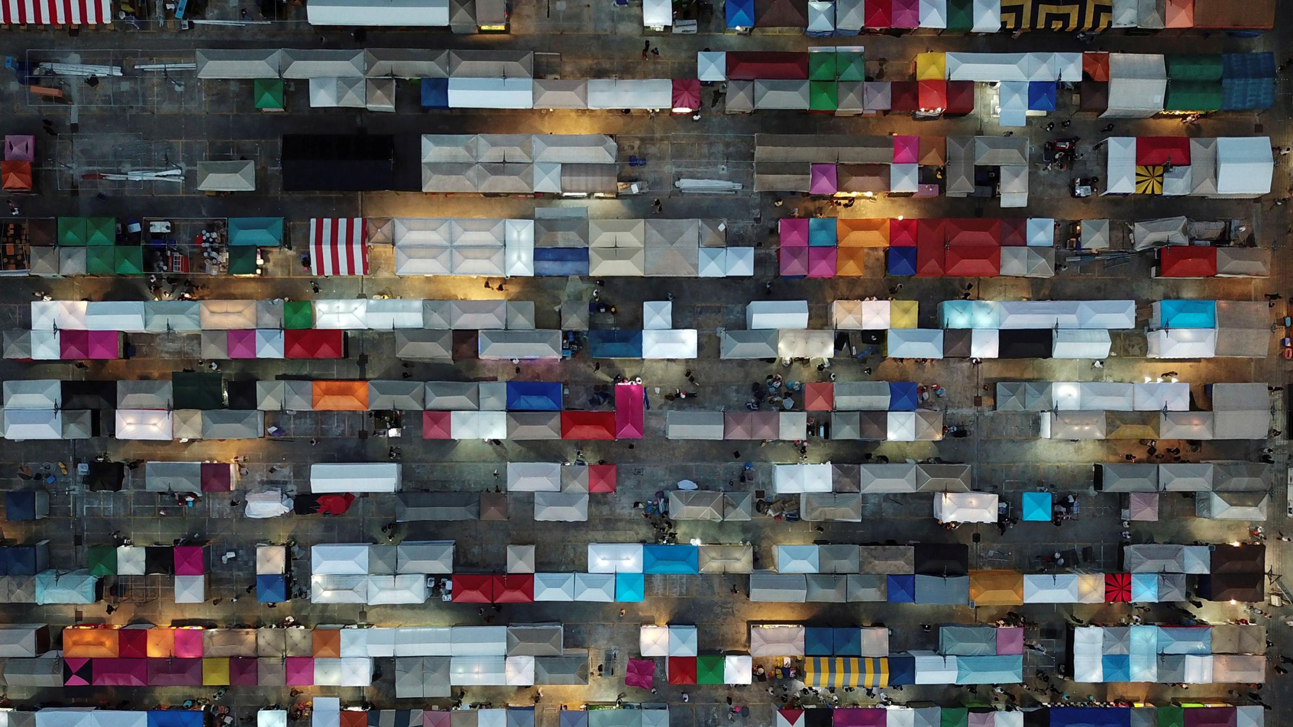 The photo shows the market from above, appearing like a quilted patch with all the square stalls.
