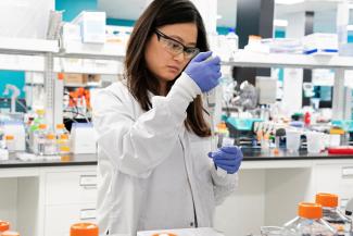 Research assistant Marion Hong, of RNA medicines company Arcturus Therapeutics, conducts research on a vaccine for COVID-19, in San Diego, California, on March 17, 2020. 